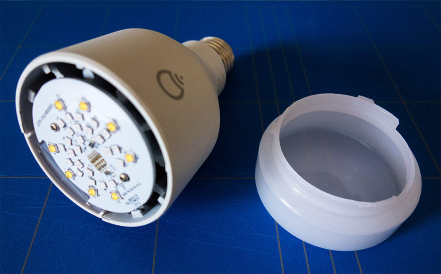 Grab the plastic diffuser, rotate clockwise and rise to unscrew it from the bulb.
